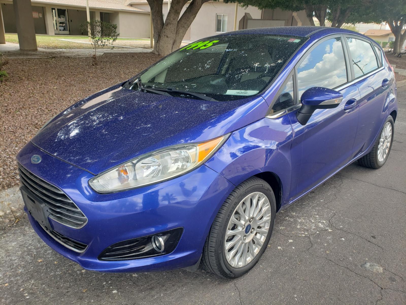 2014 /Tan and black Ford Fiesta Titanium (3FADP4FJ5EM) with an 1.6l i4 engine, 6-Speed Automatic transmission, located at 323 E Dunlap Ave., Phoenix, AZ, 85020, (602) 331-9000, 33.567677, -112.069000 - 2014 Ford Fiesta Titanium,.......A Must See!!... No accidents, Only 95K MILES.... Ice cold AC. The car is gorgeous inside and out. Power windows, Power door locks, Touch screen Stereo/ CD Player, Phone sync, Bluetooth, Satellite compatible, Backup camera, Beautiful tan and black interior with tan le - Photo #0